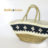 woven-raffia-bag-adorned-with-snails