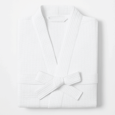 Pure Cotton Waffle Bathrobe neatly with kimono collar and belt, showcasing its textured fabric and lightweight design—perfect for spa, hotel, or home use.